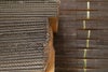 Stacked and bundled corrugated sheets