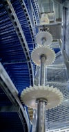 Edge sprockets along elevating/de-elevating Side Drive conveyor