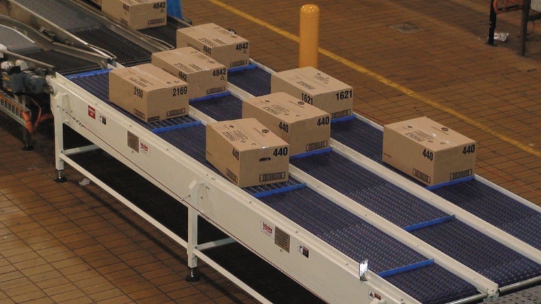 Cardboard case package boxes on ARB conveyors
