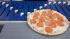 Trieur AIM pour la manutention de pizzas