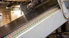 Tire rubber on inclined conveyor with gray belt