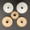 White and tan Series 1000 sprockets in varying sizes