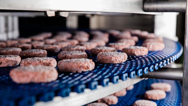 Uncooked hamburger patties on DirectDrive spiral