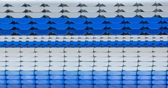 Side profile of several different Intralox Heavy-Duty Edge (HDE) conveyor belts stacked atop each other