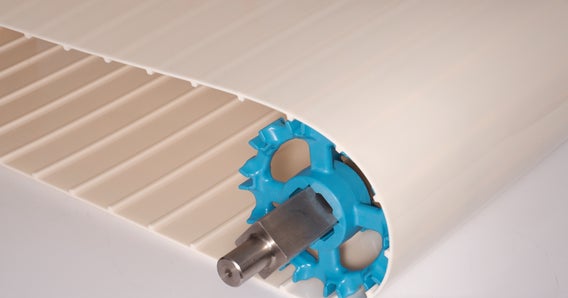 Tapis ThermoDrive en HTL blanc enroulé autour de pignons bleus