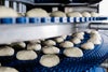 Balls of dough proofing on an Intralox spiral conveyor