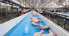 Raw chicken on a ThermoDrive conveyor belt inside a poultry plant