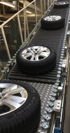 Tires traveling up modular plastic incline belt