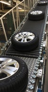 Tires traveling up modular plastic incline belt