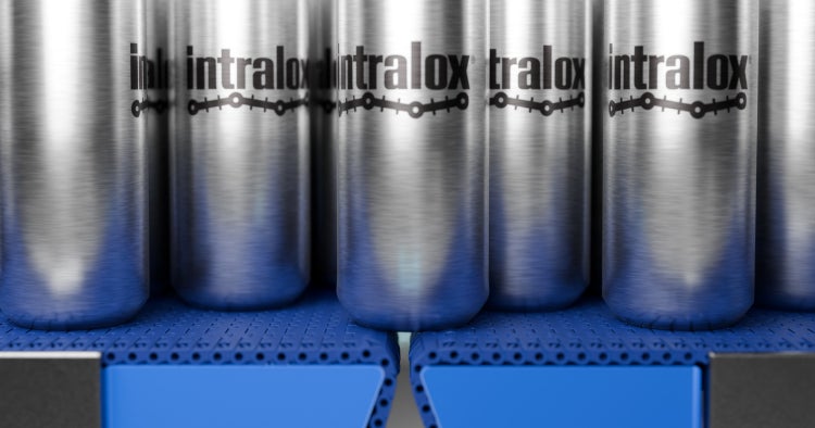 Cans aligned on an Intralox S570 belt