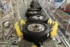 Tires on roller top accumulation conveyor belts