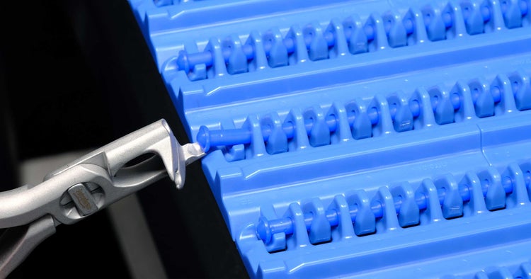 Intralox Rod Remover dislodging belt rod from conveyor belt