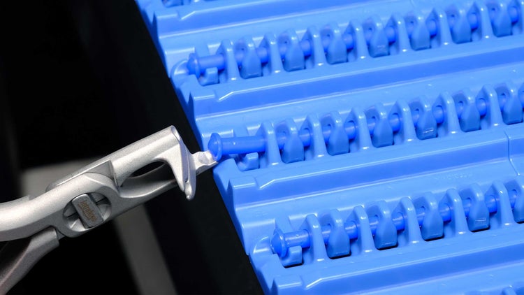 Intralox Rod Remover dislodging belt rod from conveyor belt