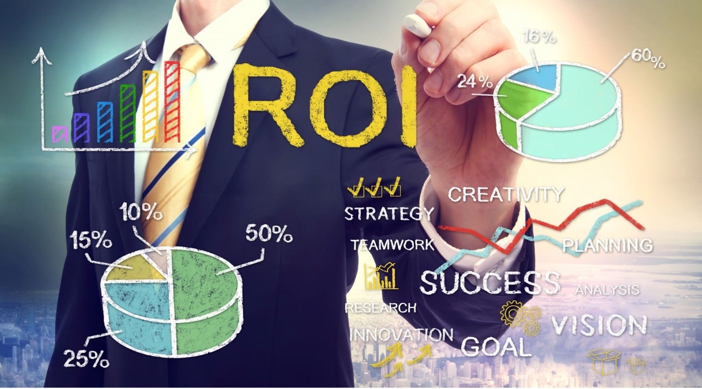 photo of man in suit with chalk with ROI diagrams over the photo