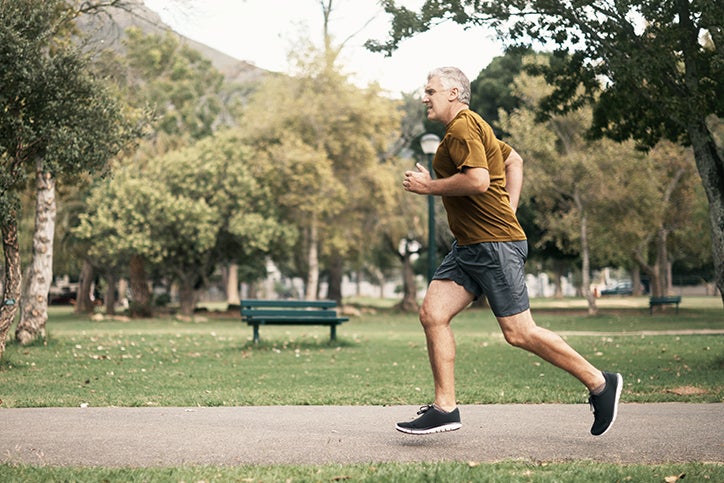 A man jogging through a park