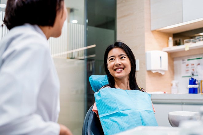 New year, new benefits for RT Health members. Photos shows a lady waiting in a dental chair, using her dental benefits from her extras health insurance.