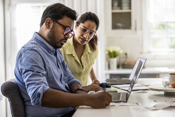 A couple researching the Medicare Levy Surcharge