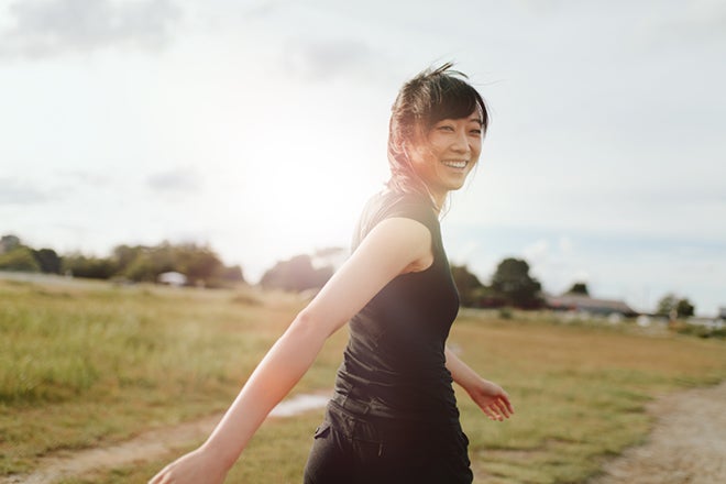 Fitting exercise into your busy day. A young woman exercising outside.