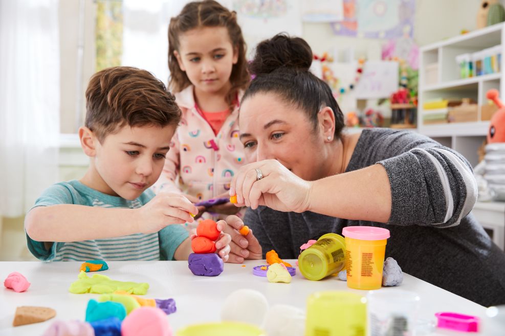 Children playing with PlayDoh toy