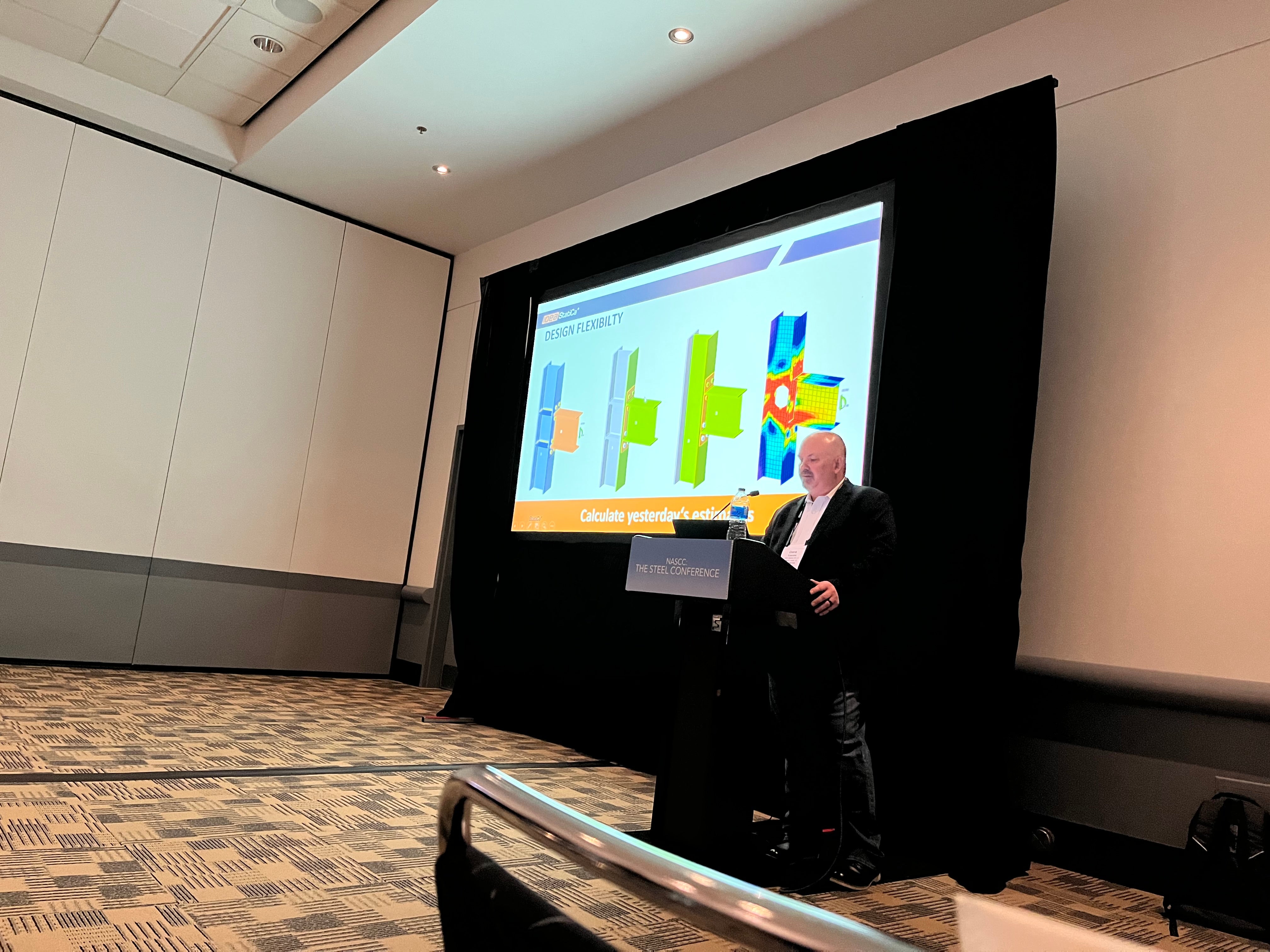 Dave Eckrote, Country Manager of IDEA StatiCa US, delivering a presentation on steel connection design at NASCC 2022