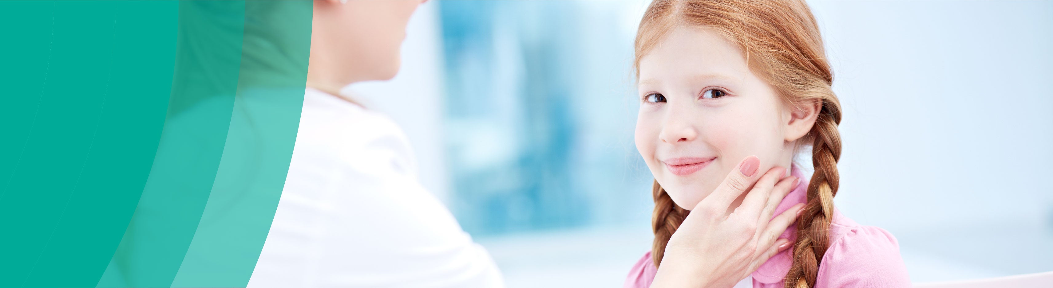 Healthcare examining a smiling girl's neck