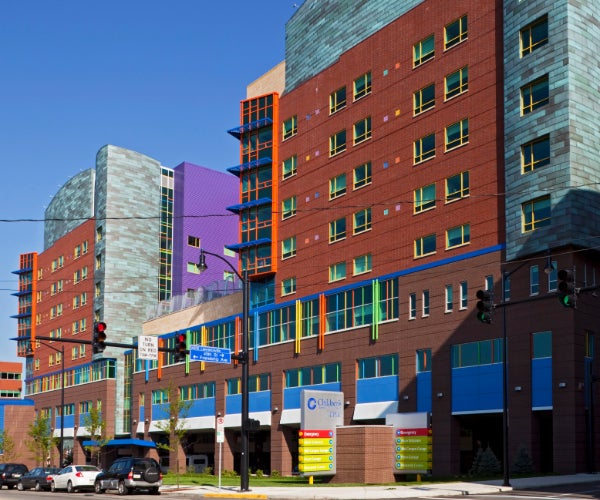 Brightly colored children's hospital painted in brown, purple, red, yellow, green and blue.