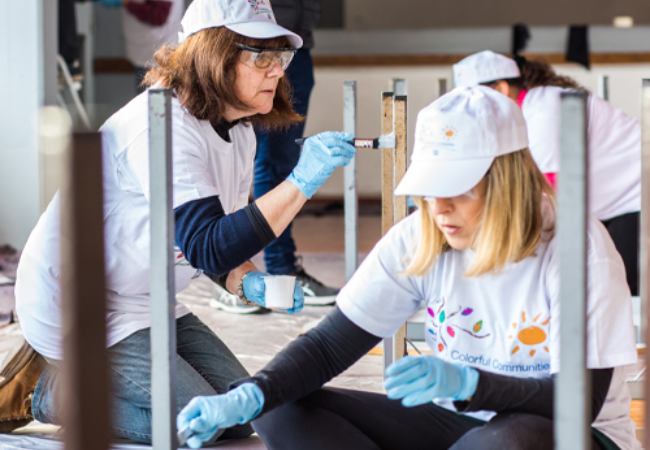 volunteers painting desks in Sacavém, Portugal 