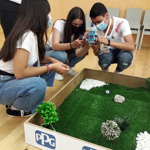 youth playing with robotics