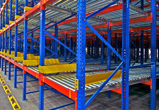 Empty blue and yellow pallet racking system in a warehouse