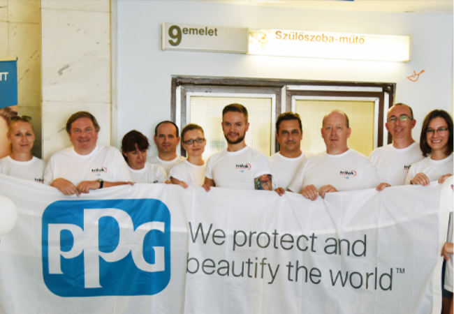 Group of volunteers holding a PPG flag in Budapest Hungary 