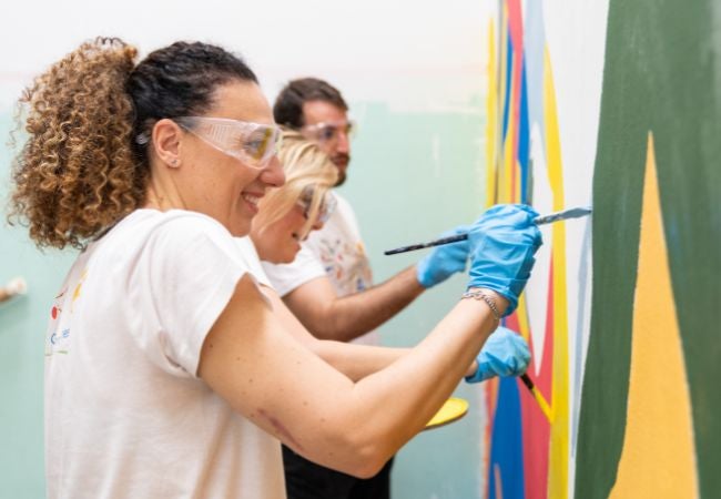 Painters create colorful mural