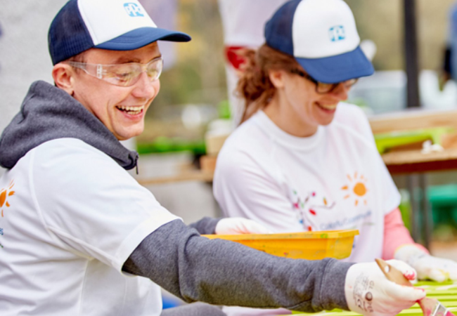 two volunteers painting