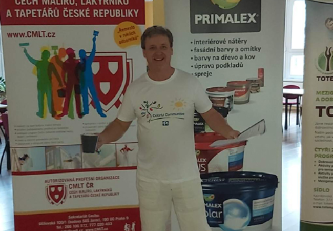 man posing in front of information boards