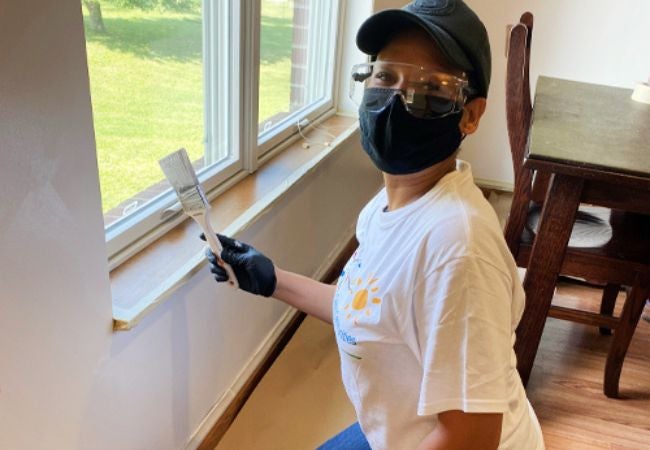 woman holding paint brush