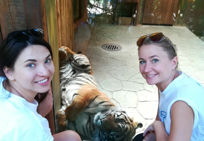 two girls playing with lion in Brno, Czech Republic 