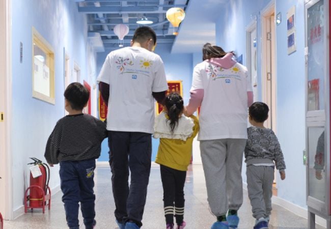 family walking down hall