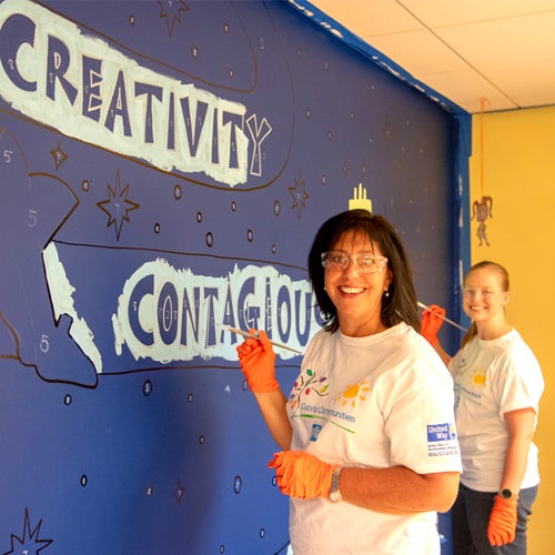 PPG employees painting classrooms