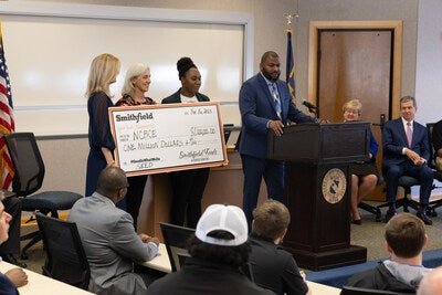 Steve Evans, vice president of community development for Smithfield Foods, visited Wayne Community College on Nov. 16 to present a $1 million check to NCBCE to fund the SEED apprenticeship program.
