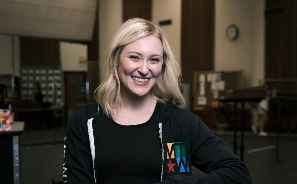 Blonde woman from Music Theatre of Wichita smiling at the camera