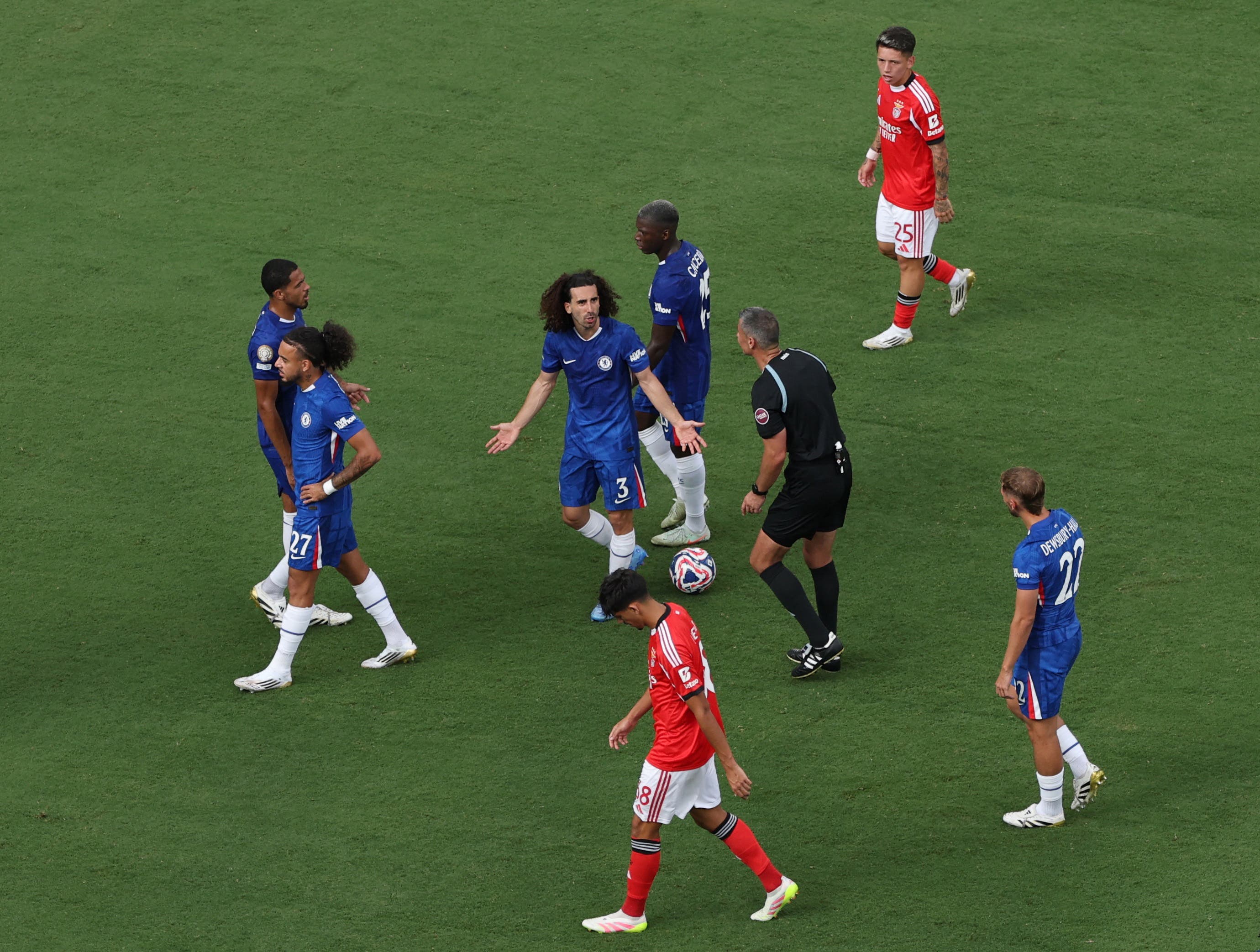 Chelsea's Marc Cucurella reacts as referee Slavko Vincic signals a weather delay to the match