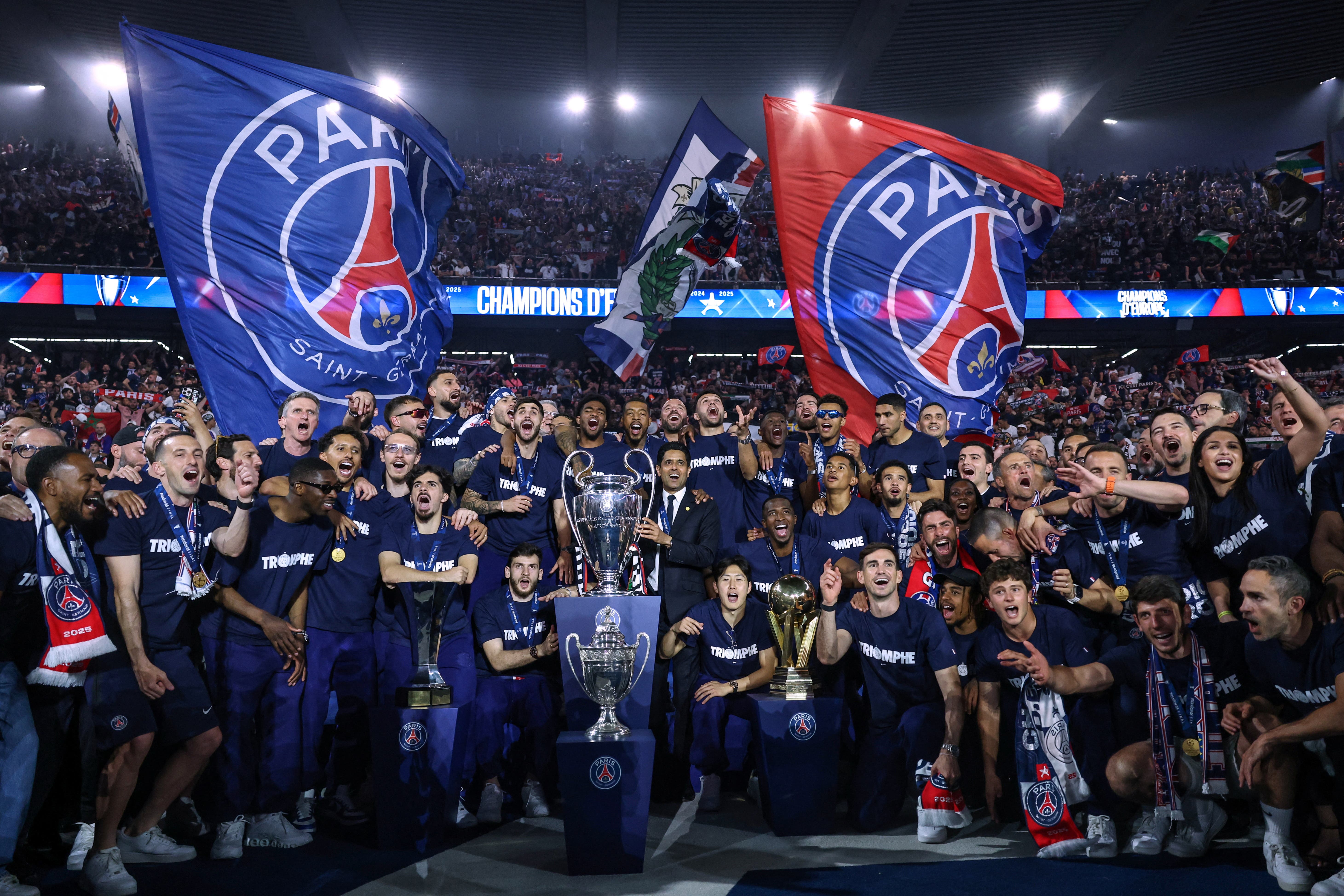 Paris St Germain's players, staff and president Nasser Al-Khelaifi during a ceremony to present the trophy a day after the club won the UEFA Champions League.