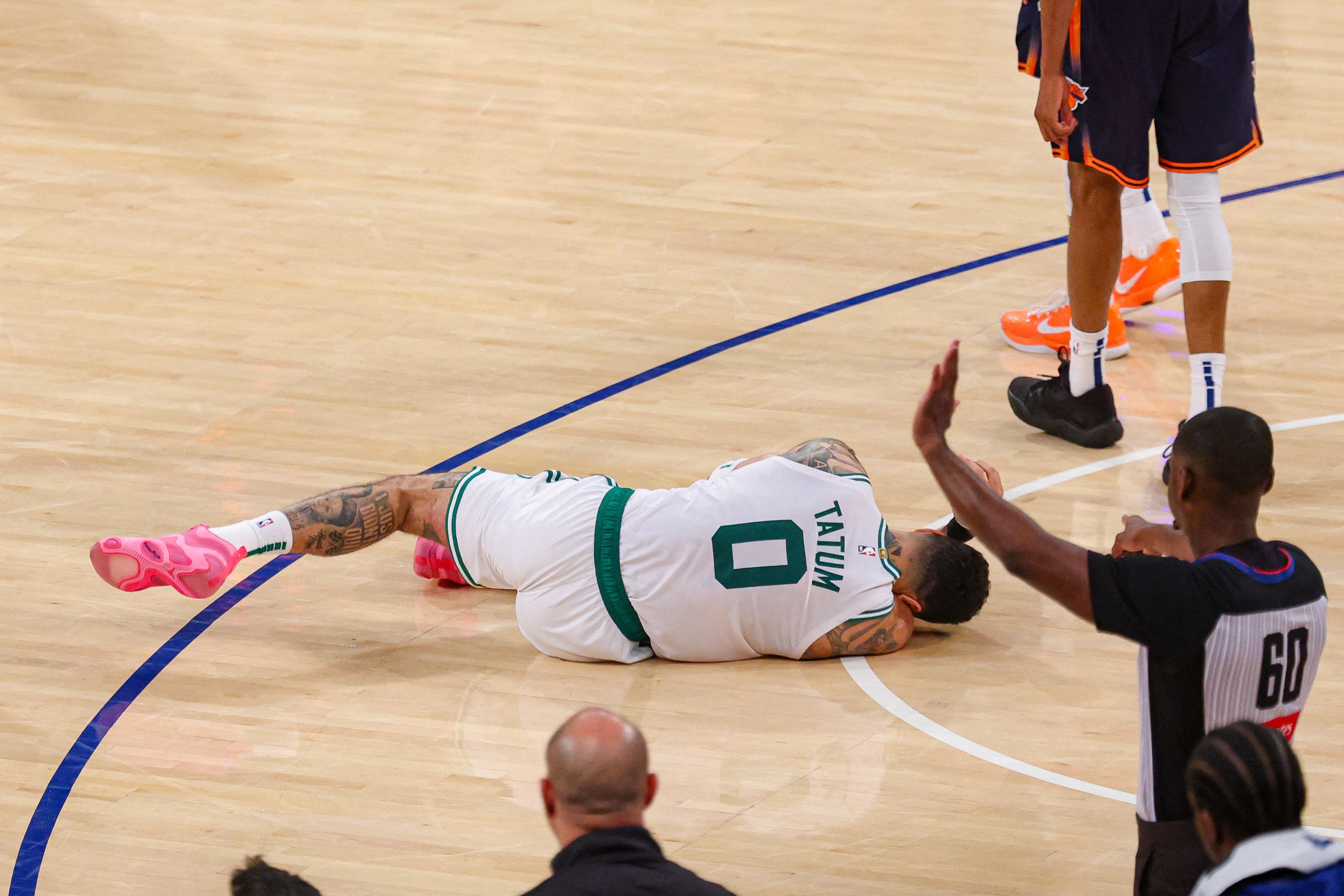 Boston Celtics' Jayson Tatum on the floor after suffering non-contact injury.