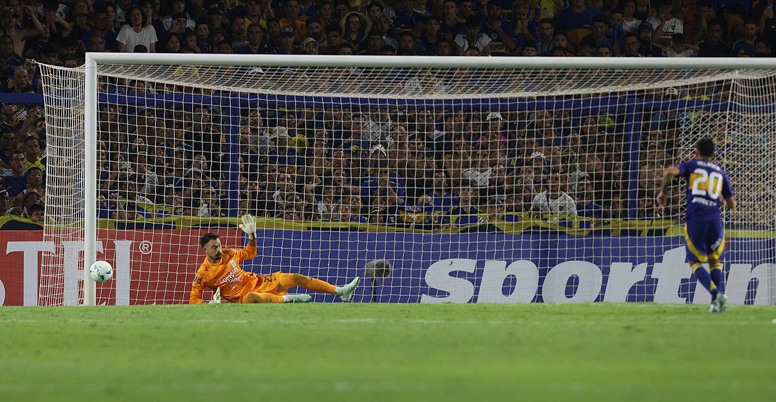 Boca Juniors' Alan Velasco misses the decisive penalty during the shootout 