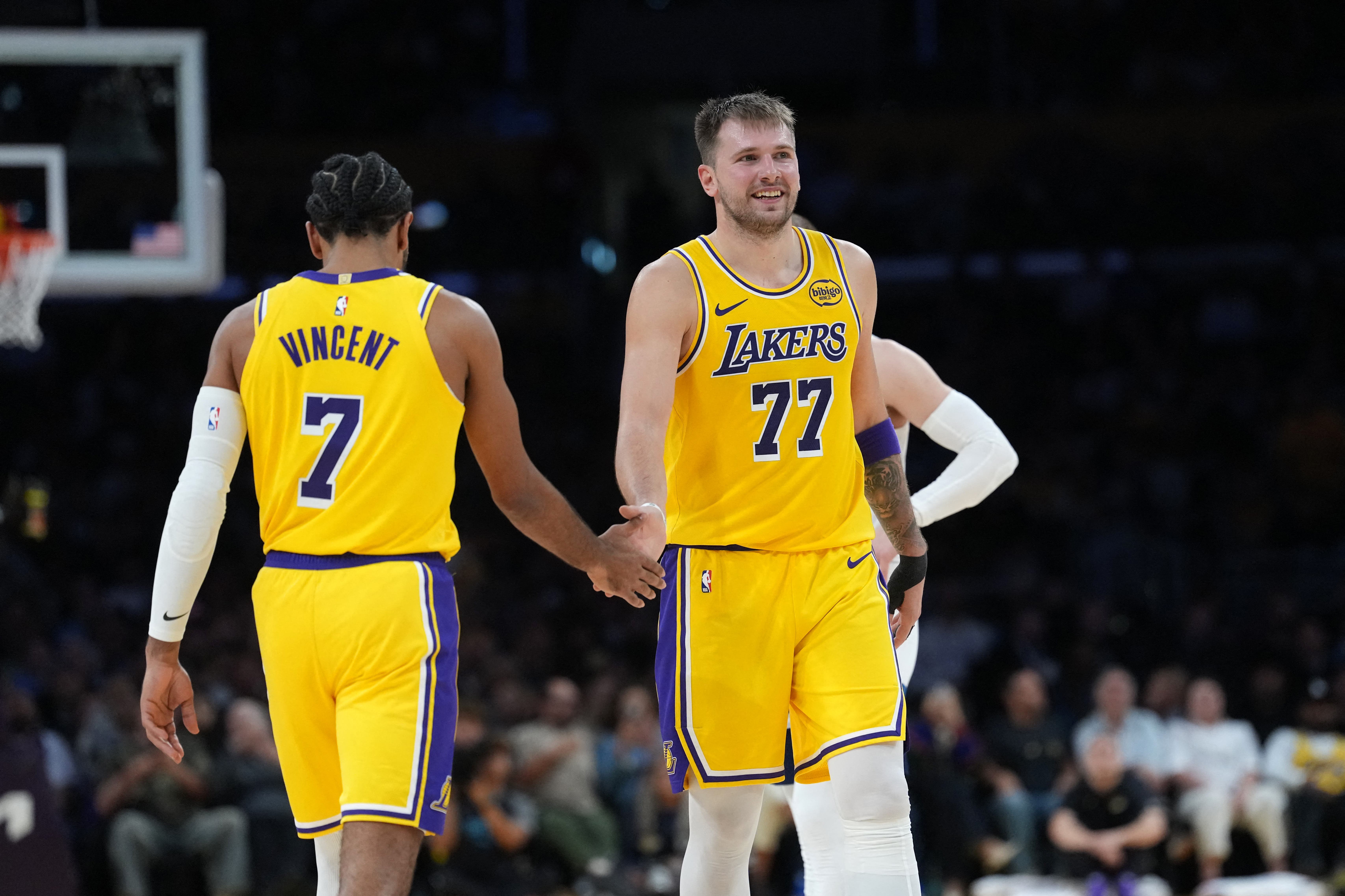 Gabe Vincent and Luka Doncic playing for the Los Angeles Lakers.