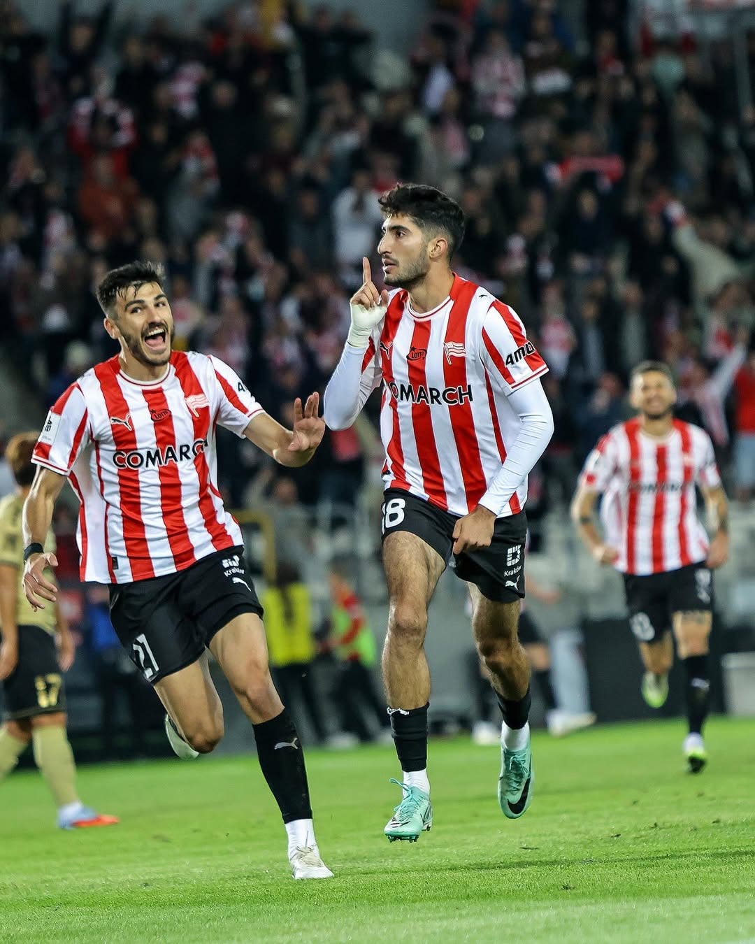 Kahveh Zahiroleslam celebrates a goal during a match with Cracovia.