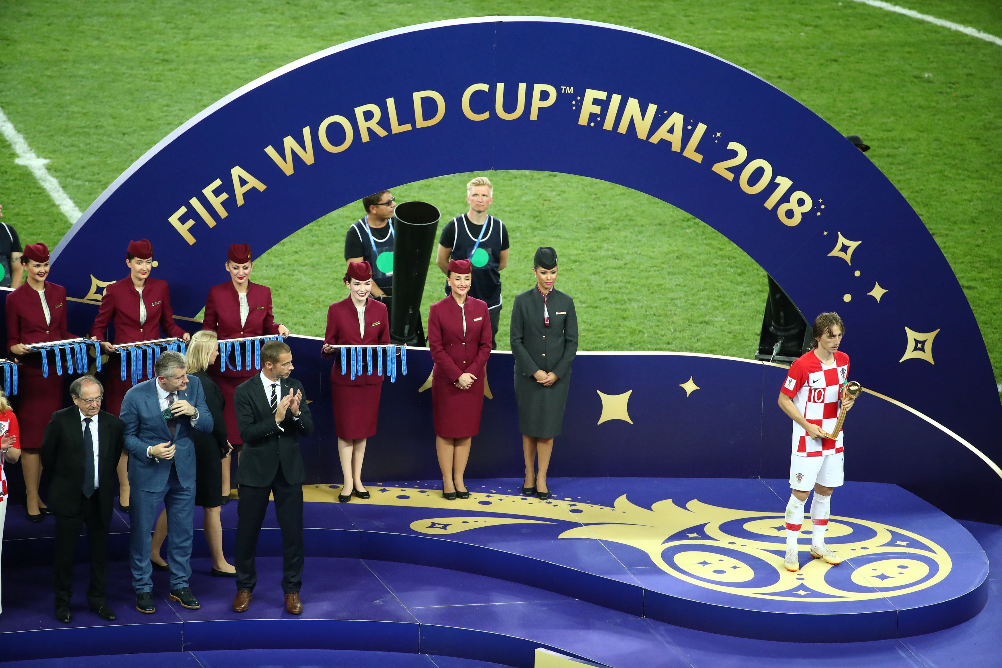 Croatia's Luka Modric looks dejected as he holds his trophy during the presentations