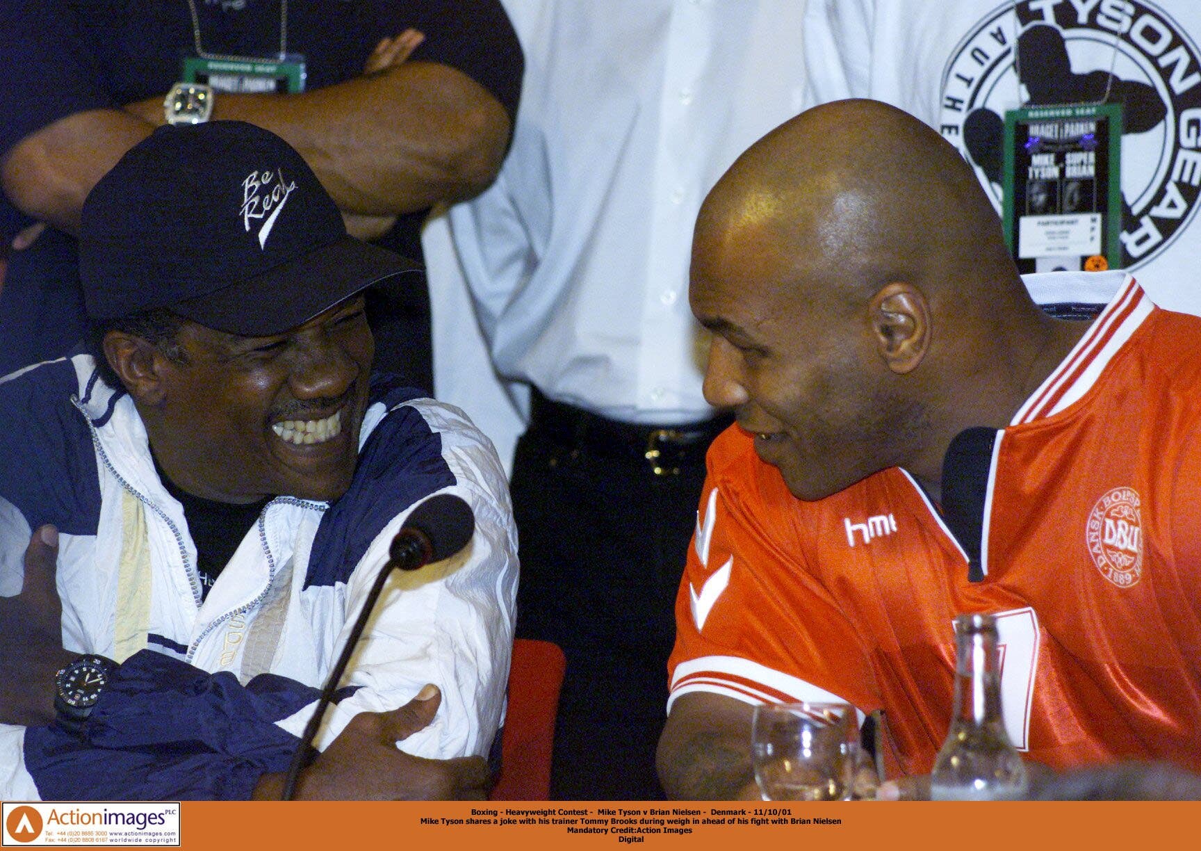 Boxing - Heavyweight Contest - Mike Tyson v Brian Nielsen - Denmark - 11/10/01 Mike Tyson shares a joke with his trainer Tommy Brooks during weigh in ahead of his fight with Brian Nielsen Mandatory Credit:Action Images Digital
