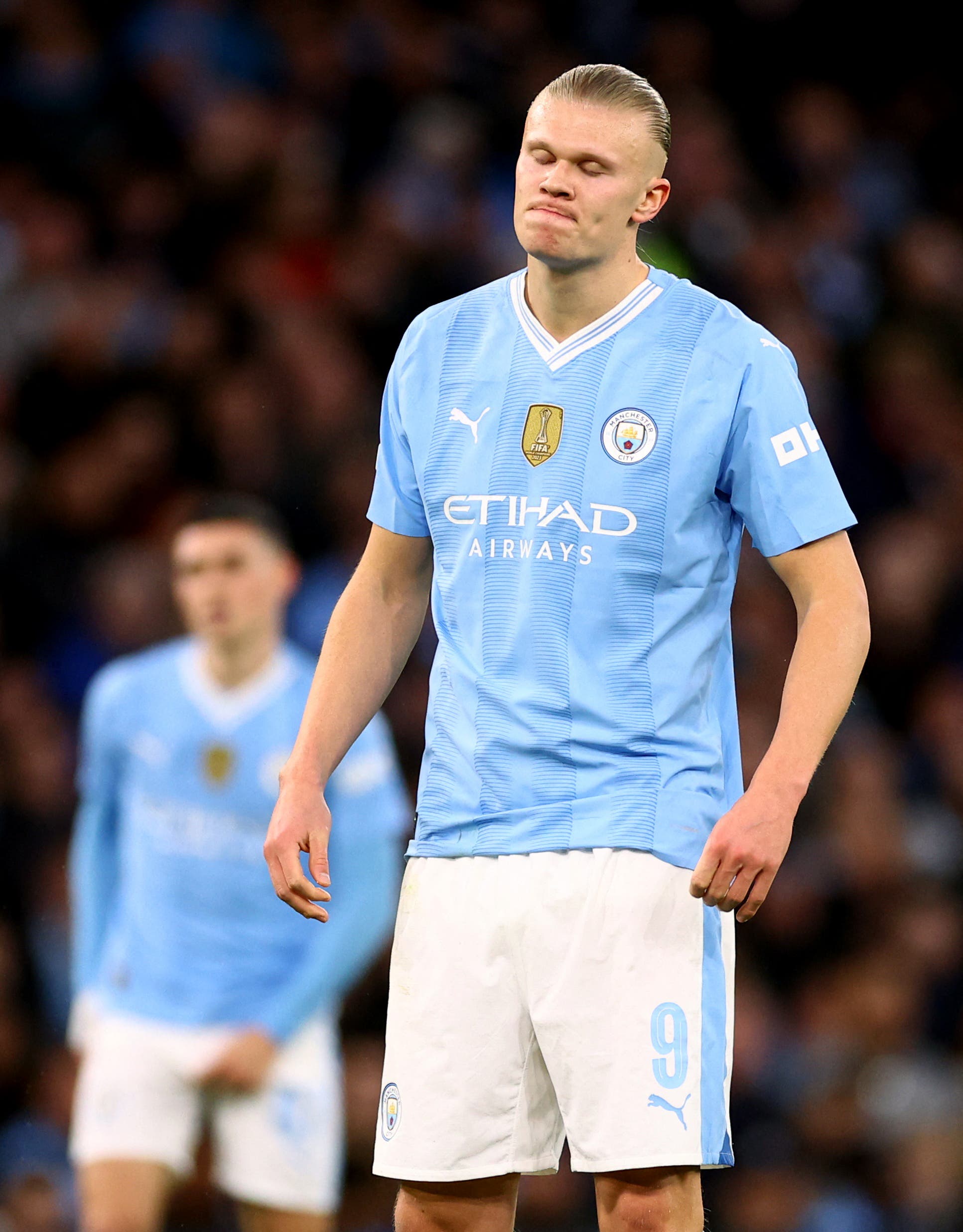 Manchester City's Erling Braut Haaland looks dejected after Real Madrid's Rodrygo scores their first goal 