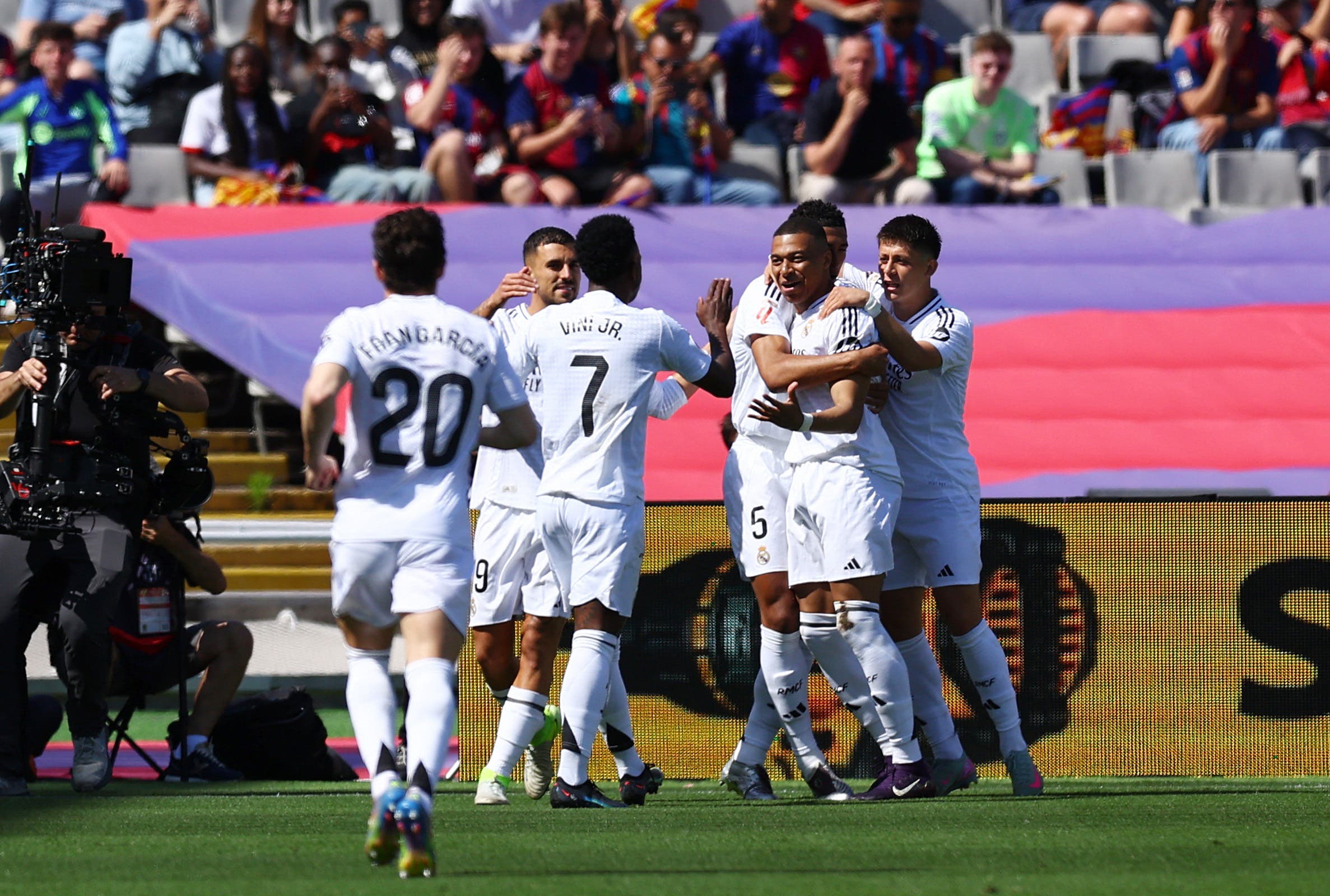 Real Madrid's Kylian Mbappe celebrates scoring their first goal with team mates