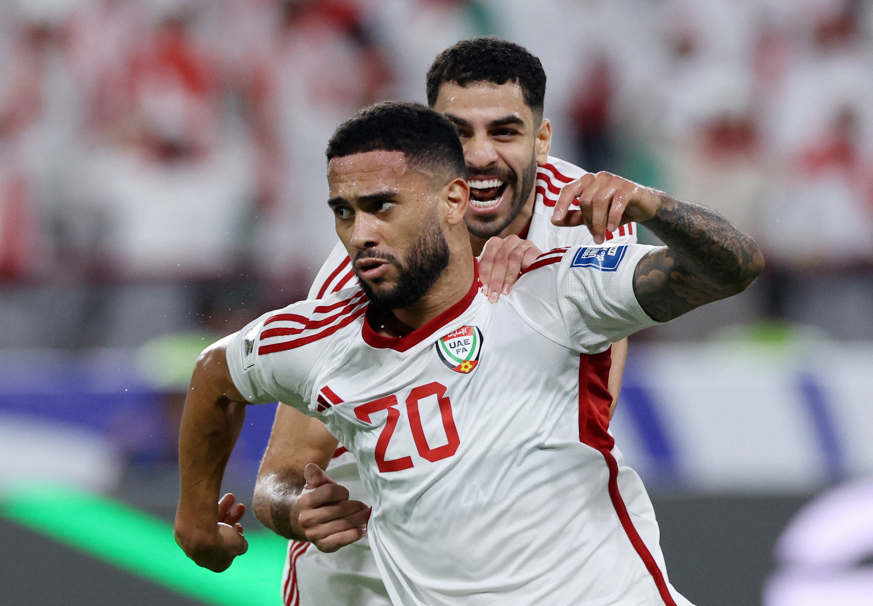 Soccer Football - FIFA World Cup - AFC Qualifiers - Fifth Round - First Leg - United Arab Emirates v Iraq - Mohamed bin Zayed Stadium, Abu Dhabi, United Arab Emirates - November 13, 2025 United Arab Emirates's Luan Pereira celebrates scoring their first goal with Sultan Adil Alamiri REUTERS/Amr Alfiky